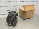 a small engine and a box on a table in front of a box