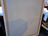a picture of a picture frame on the floor in a room