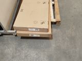 a box on a pallet in the middle of the floor
