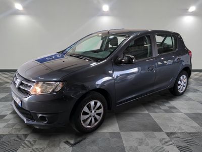 a picture of a grey car parked in a garage