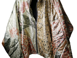 a jacket hanging on a hanger on a white background