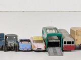 a lot of toy trucks that are lined up together