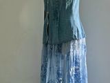 a dress on a mannequin stand in a room
