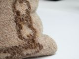 a teddy bear sitting on top of a white table