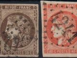 a close up of a group of stamps on a black surface