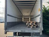 the back of a moving truck with a lot of boxes in the back