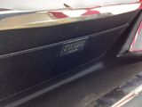 a close up of a car ' s rear bumper with a sticker on it