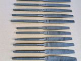 a set of six pairs of surgical tools sitting on a table
