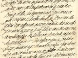 une lettre écrite en cursive sur une feuille de papier