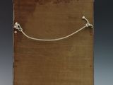 a small wooden box with a rope on top of it
