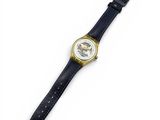 a close up of a watch on a white surface with a white background