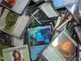 a pile of card game cards on a table