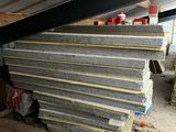 a close up of a pile of concrete blocks under a roof
