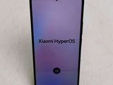 a close up of the back of a purple and black phone