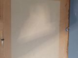 a picture of a picture hanging on the wall above a radiator