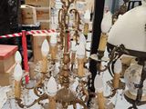 a chandelier that has a lot of lights hanging from it