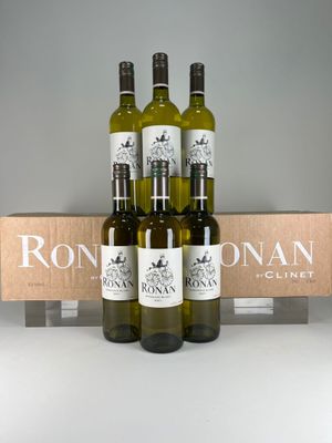 three bottles of wine are sitting in front of a box of wine