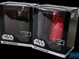 two star wars action figures are in a box on a black background
