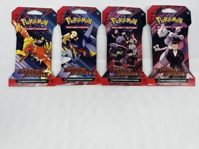 three packs of pokemon trading cards