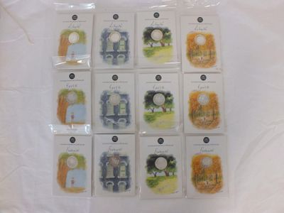 many cards of different designs on a white surface