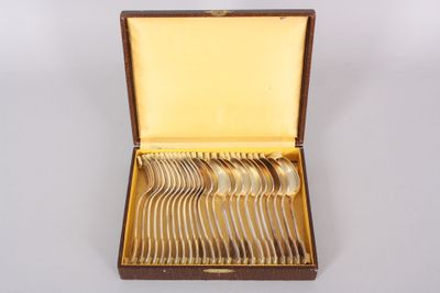 a wooden box with silverware in it on a white surface
