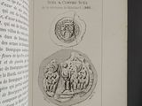 an open book with a drawing of a man and a woman on it