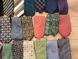 a lot of ties that are on the floor