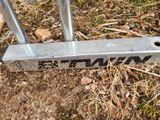 a close up of a metal pole with a sign on it