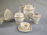 a lot of cups and saucers that are on the table