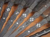 a close up of a bunch of scissors on a table