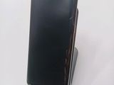 a cell phone that is sitting on top of a stand