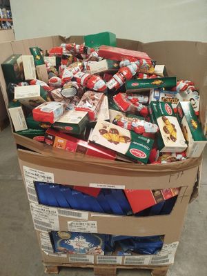 a cardboard box full of food that is sitting on top of a pallet