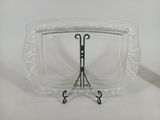 a glass display case with a pair of scissors in it