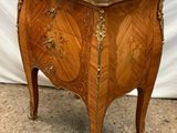 an image of a small wooden table with a marble top