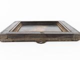 an old wooden tray with a painting on it on a white surface