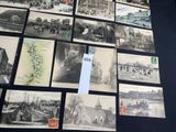 a lot of old postcards on display on a table