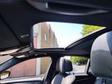 a view of the sunroof from inside of a car