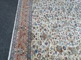a rug on the floor with a cat laying on it
