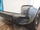 a close up of a car ' s bumper with mud on it