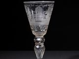 a wine glass that is sitting on a table