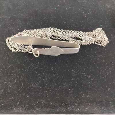silver plated tie bar on a chain with a clasp