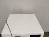 a washing machine that is sitting on the floor
