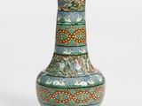 a vase that is sitting on a white surface