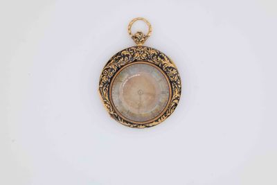 a close up of a gold locke with a picture of a woman on it
