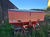 a red wagon that is sitting on the side of the road