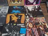 a lot of records on a table in a room