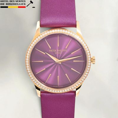 the purple watch has a diamond bezeled face and a pink leather strap