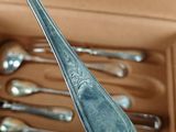 a box with spoons and silverware inside of it
