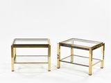 a pair of brass and glass side tables