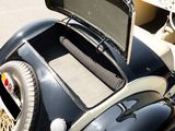 a black and white car with a monitor in the back